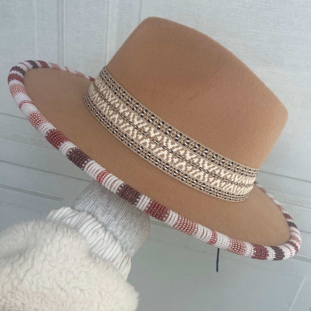 Hand beaded flat brim hat.