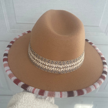 Hand beaded flat brim hat.