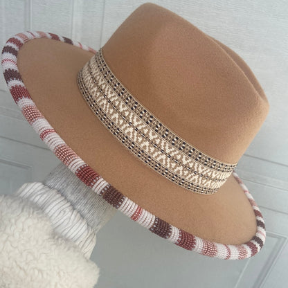 Hand beaded flat brim hat.