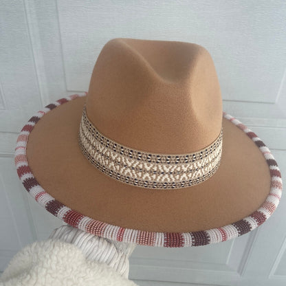 Hand beaded flat brim hat.